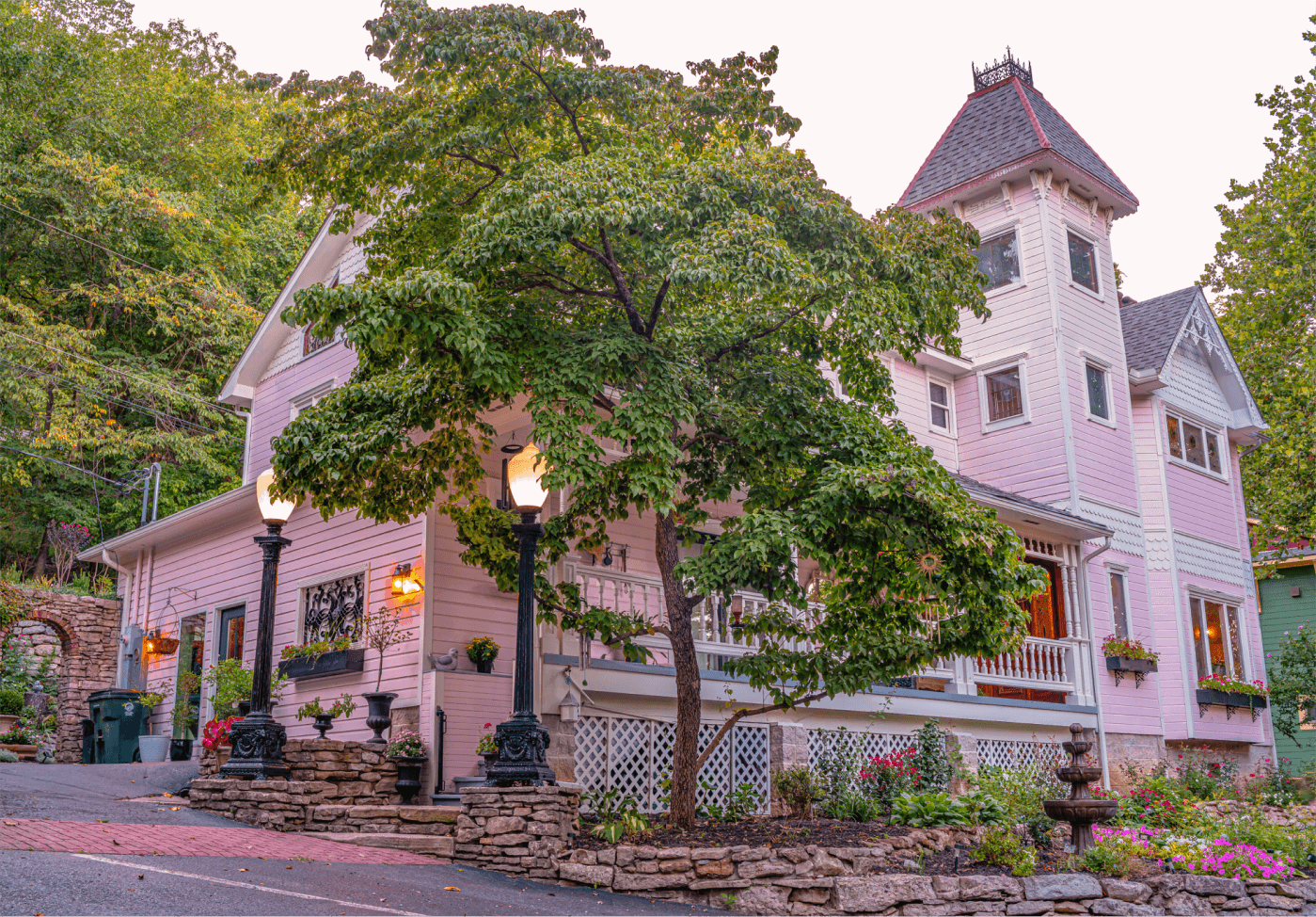Inn at Rose Hall at dusk, its street lamps glowing beside the front garden